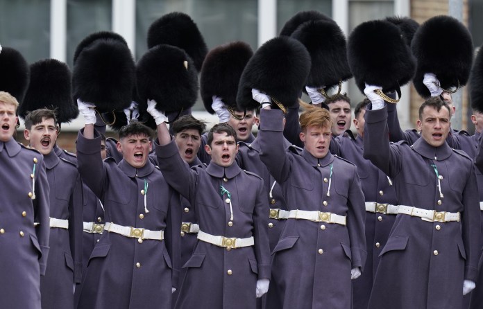 Members of the Welsh Guards give three cheers during the St David’s Day visit by the royal couple 