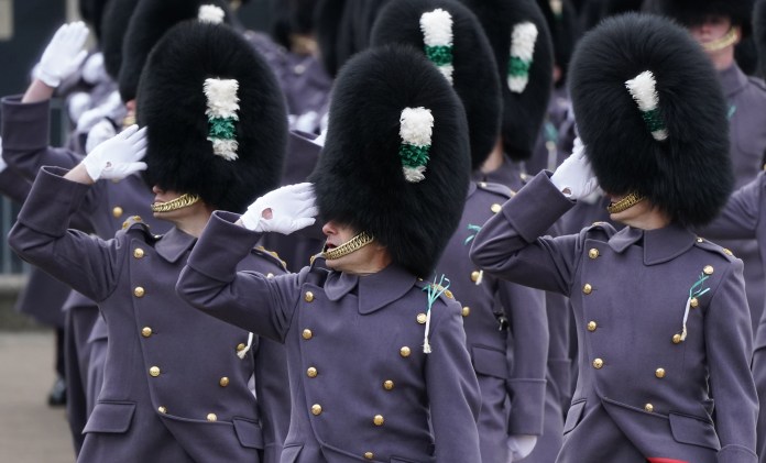 Members of the Welsh Guards salute